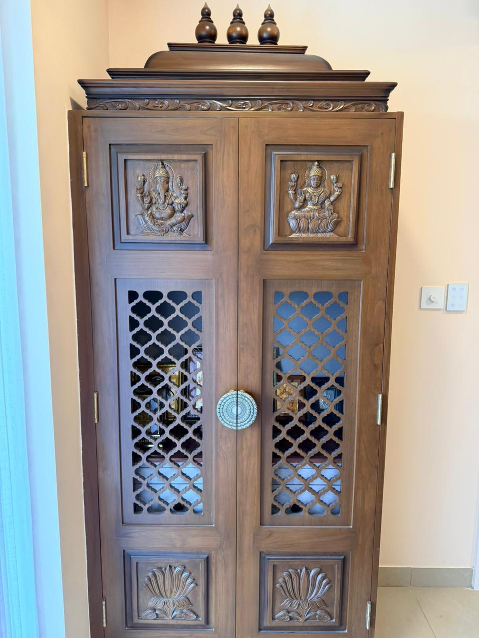 Handcrafted pooja cabinet woodwork design for premium interiors