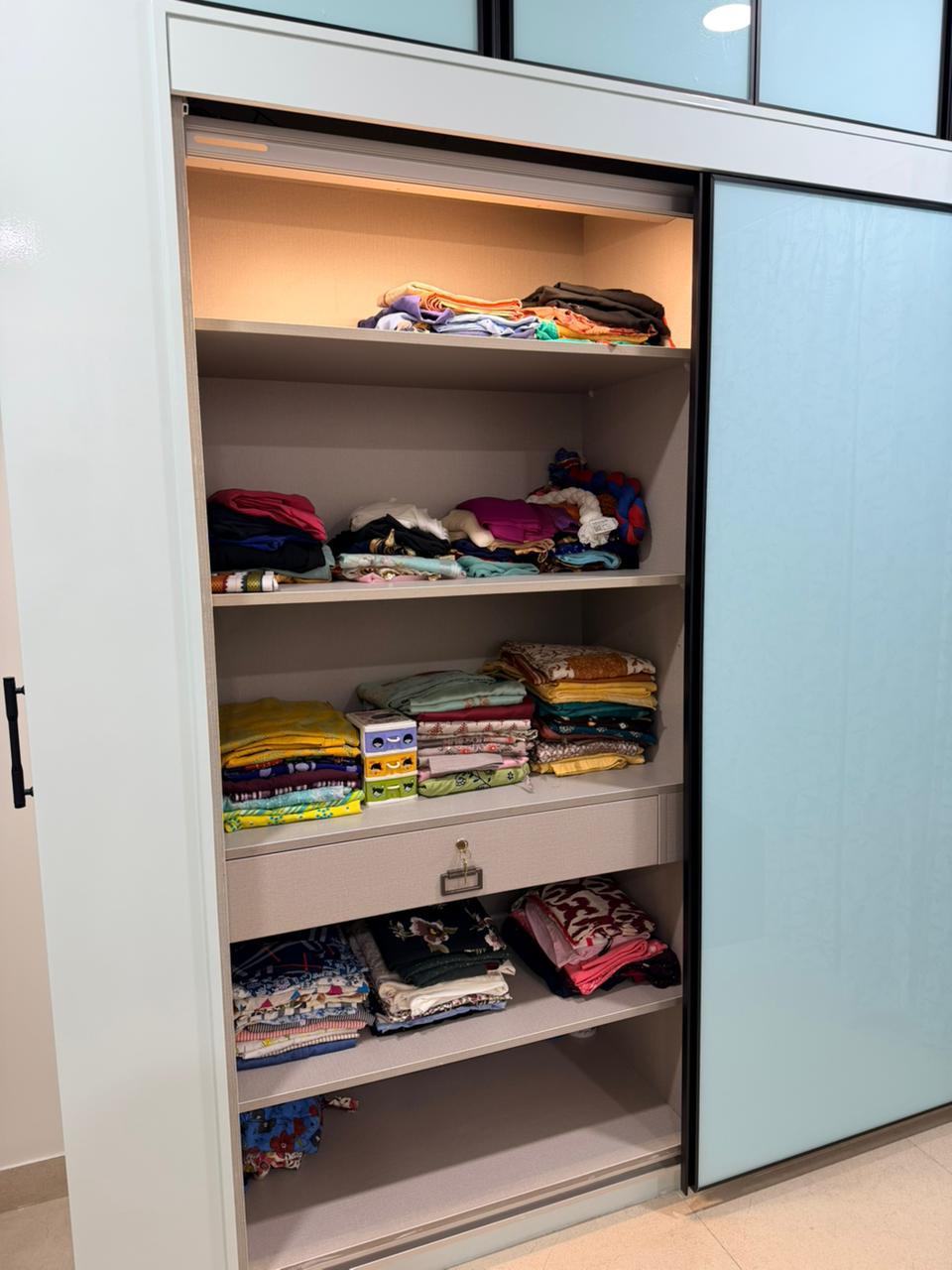 Open wardrobe storage shelf design for premium interiors