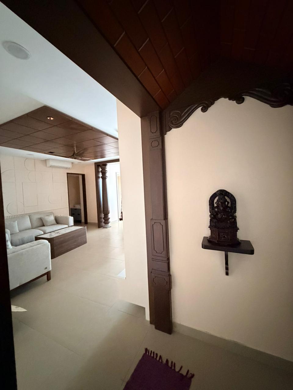 Pooja niche and entry corner design for premium homes