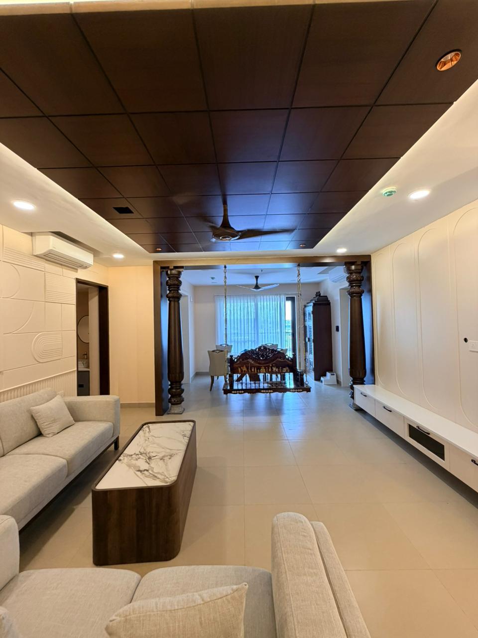 Premium living and dining hall with swing design in Chennai