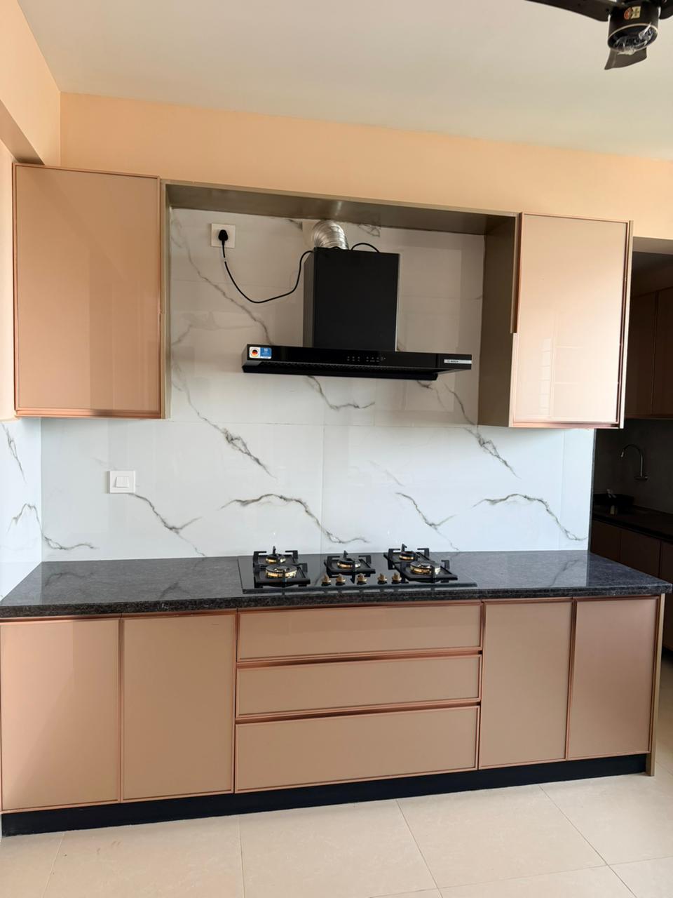 Premium modular kitchen with marble backsplash in Chennai