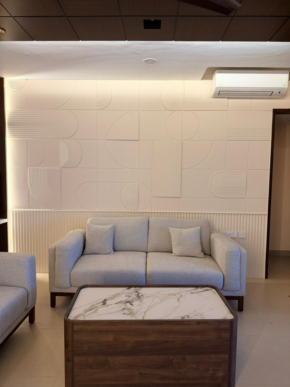 Premium modern living room sofa and wall panel design in Chennai