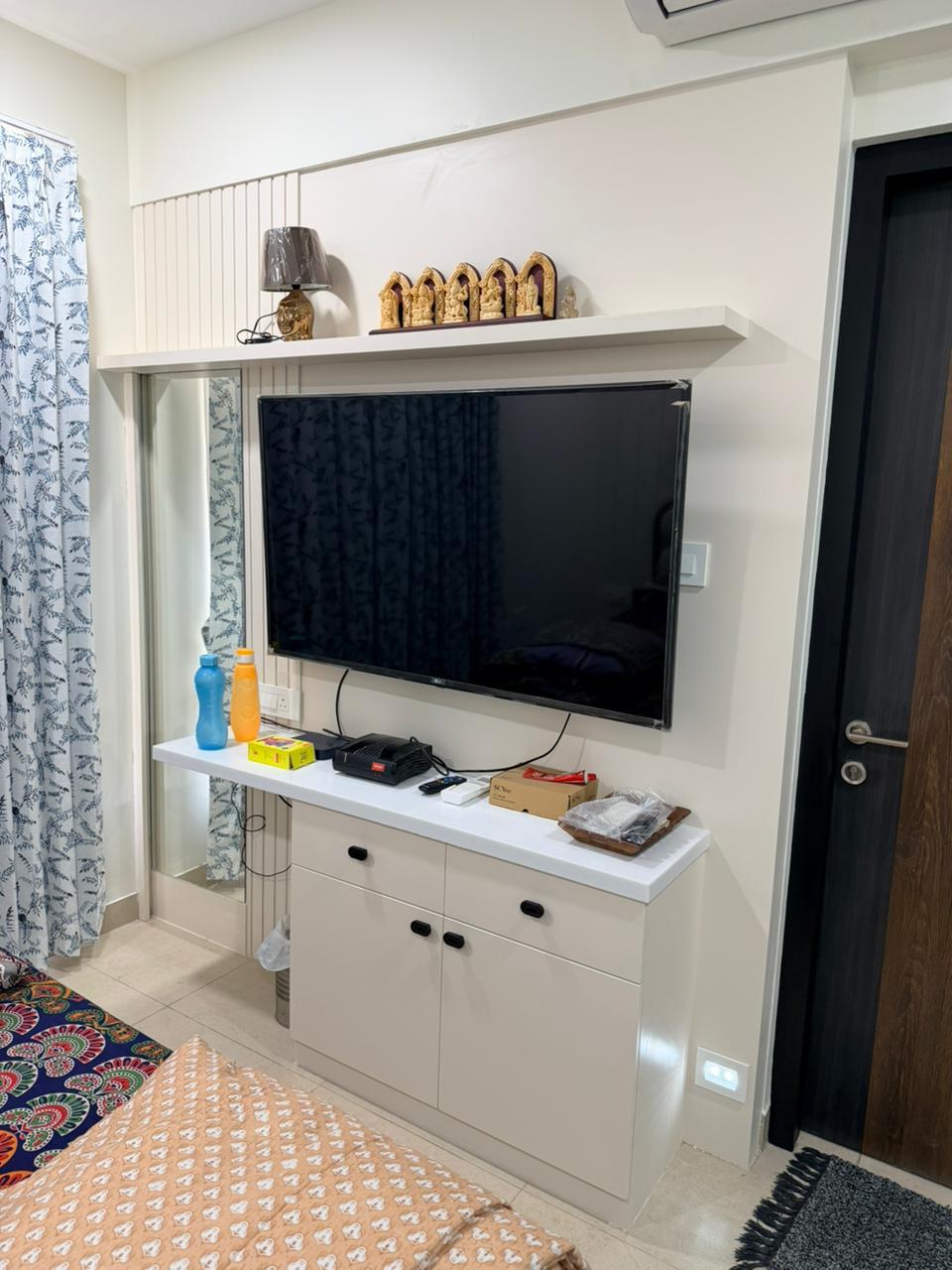 Premium white TV unit and storage design in Chennai