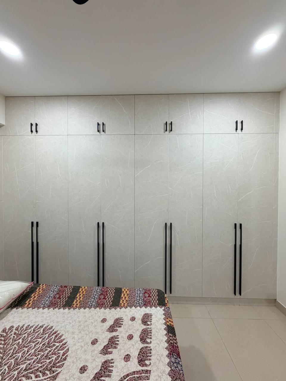 White wardrobe and bedroom storage design for modern apartments
