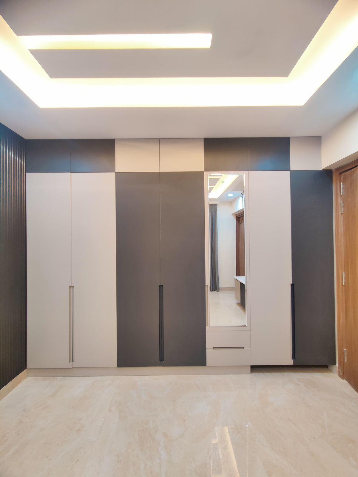 Modern wardrobe and false ceiling design for bedroom interiors