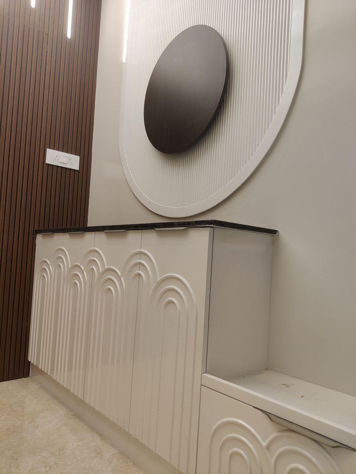 Round mirror console and wall panel interior design